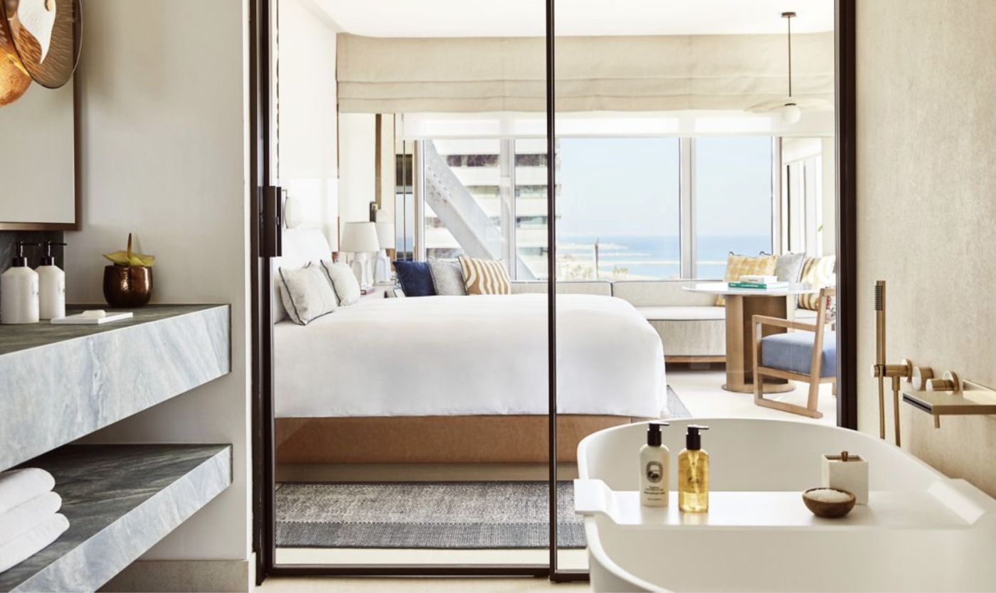 Guest room with sea view and bathtub at Hotel Arts Barcelona